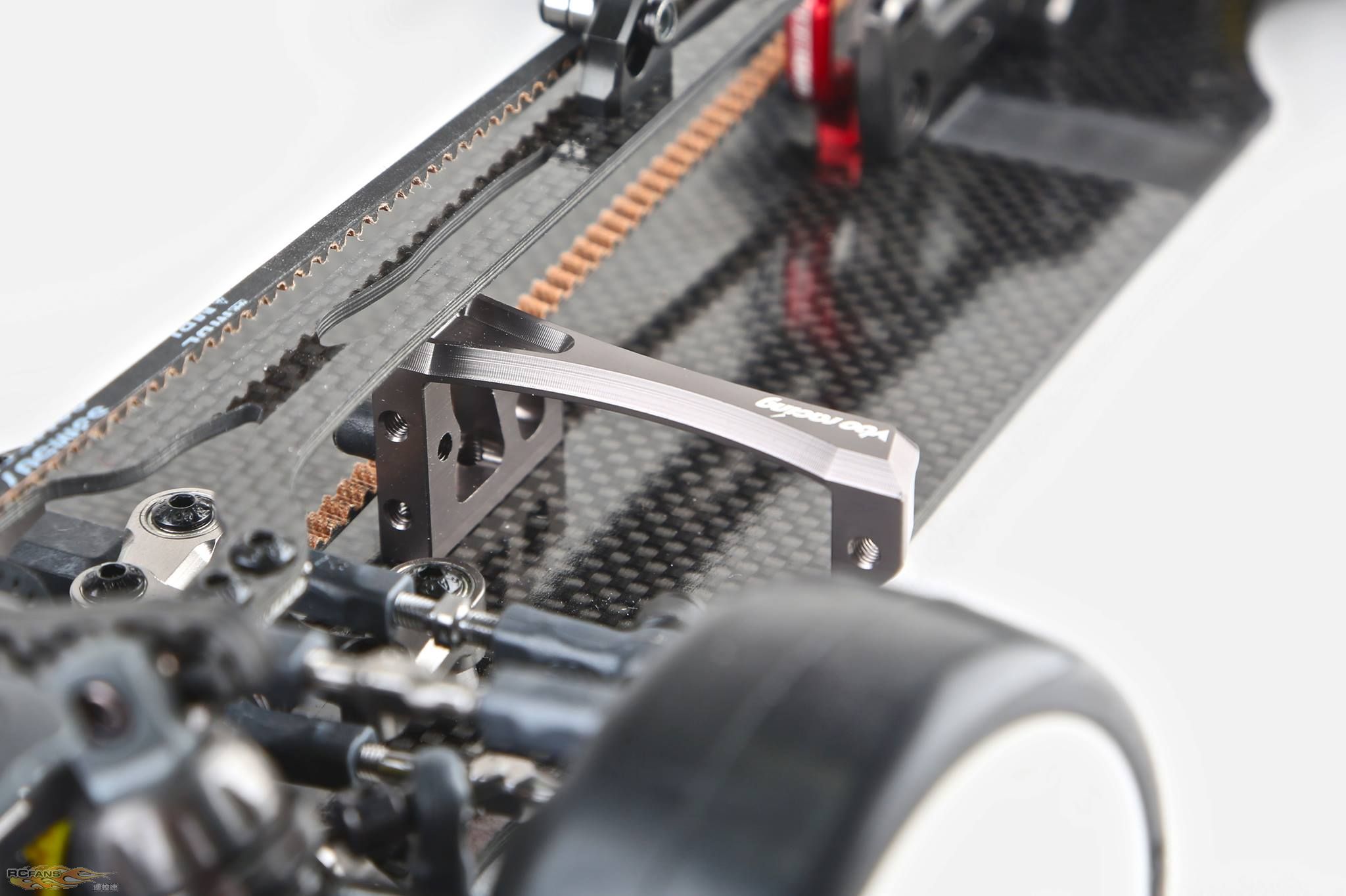 A floating servo mount is affixed directly at the chassis centerline to improve the flex symmetry of ...