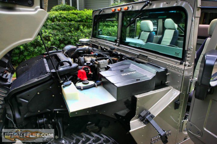 楼主正如你所发图片,悍马h1前面是个斜着的水箱.